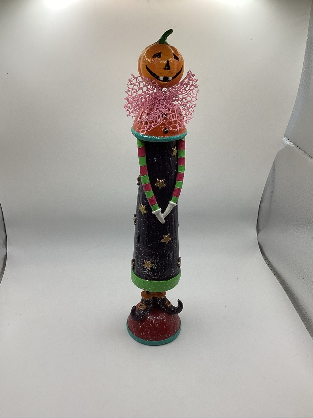 whimsical folk-art Halloween figurine jack-o-lantern head, witch shoes